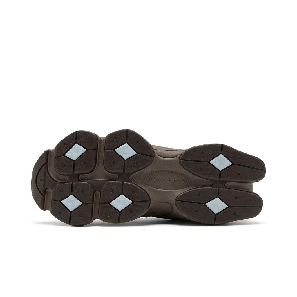 New Balance 9060 dark brown outsole with pale blue diamond inserts on white