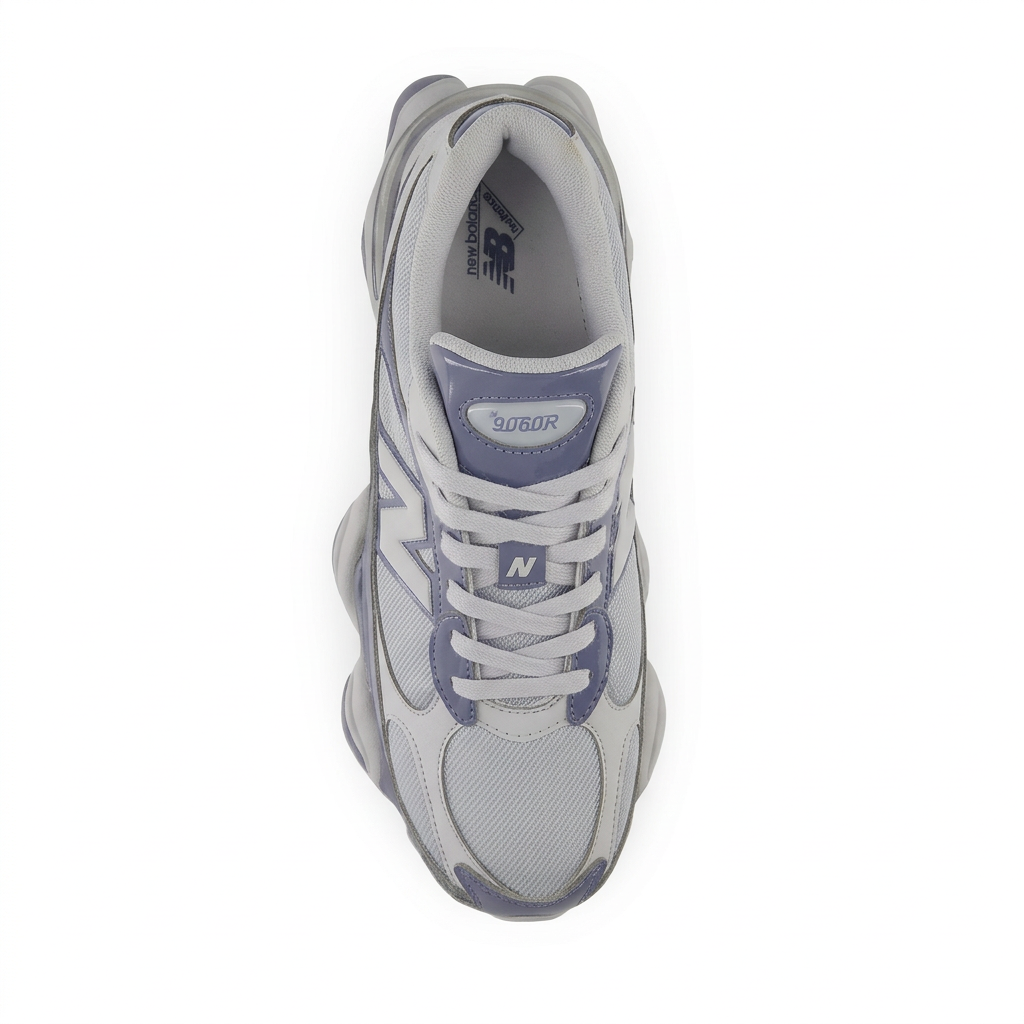 New Balance grey and navy sneaker, top view on white